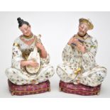 Pair of French figural scent bottles and stoppers in the form of Oriental musicians playing the