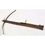 An 18th Century German crossbow, the cast iron limb 65cms (25 1/2in.
