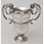 A George V two-handled trophy cup, by Walker & Hall, Sheffield 1912, of campana form,