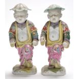 Pair of Chinese famille rose figures of dancing boys with nodding heads,