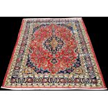 A Mashad design Persian carpet, with full scrolling floral design, 293 x 202cms (115 x 79 1/2in.).