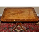 A Regency mahogany breakfast table, the rectangular top with crossbanding to edge,