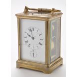 A late 19th Century brass carriage alarm clock,