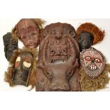 A selection of 20th Century tribal masks, including a Bembe Tribe, Congo mask, 12in.