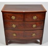 A George III mahogany bowfront chest of two short and two long graduated drawers fitted later brass