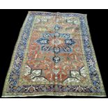 A Heriz carpet, with geometric design and floral decoration, 321 x 221cms (126 x 87in.).