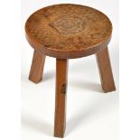 Thomas "Gnomeman" Whittaker: an adzed carved oak stool, with rose head pattern to centre,