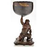 A Meiji period Japanese bronze Miyao style figural stand of an Oni holding an associated singing