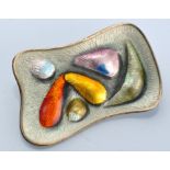 Oystein Balle, Norway: a shaped rectangular silver gilt and polychrome enamel brooch, 5.7 x 3cms.