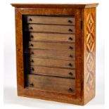 A burr walnut and specimen wood inlaid microscope slide cabinet,