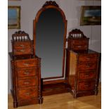 A Victorian burr walnut dressing table, the arched bevelled wall mirror flanked by pedestals,