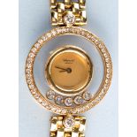 Chopard: a lady's 'Happy Diamonds Wristwatch', the circular gold coloured dial without numbers,