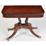 A Regency turnover swivel top card table, with ebonised stringing to top, frieze and base,
