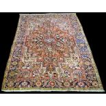 A Heriz carpet, with bold geometric floral design, 337 x 243cms (132 1/2 x 95 1/2in.).