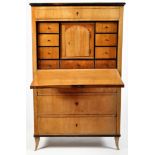 An early 19th Century German flame birch secretaire à abattant,