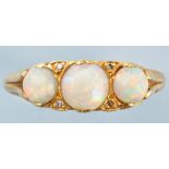 An opal and diamond ring, the three graduated circular cabouchon opals separated by diamonds,