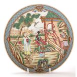 Chinese semi-eggshell Famille Rose ruby back dish, with figures conversing,