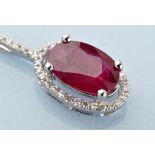 A ruby and diamond cluster pendant,