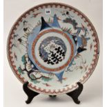 Large Japanese circular dish, central roundel enclosed by cranes or storks in flight,