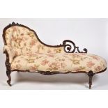 A Victorian carved mahogany chaise longue,