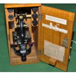 A student's microscope, by Watson, the brass and black lacquered metal case stamped 'Nkii 74245',