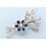 A diamond and sapphire floral spray pattern brooch,