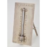 An Edwardian silver easel back presentation thermometer, by Alfred James Blake, London 1909,