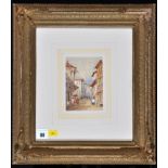In the style of Samuel Gillespie Prout (1783-1852) Figures in a Continental street scene,