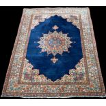 A central Persian rug, with rosette to blue ground, 200 x 130cms (78 1/2 x 51in.).