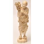 Large Japanese Meiji period ivory figure of a harvester,