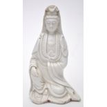 Chinese Dehua figure of Guanyin, seated with her right hand resting upon her knee,