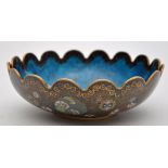 A Chinese cloisonne lobed bowl, the interior with translucent enamel upon pale blue ground,