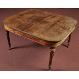 An early 19th Century mahogany extending dining table,