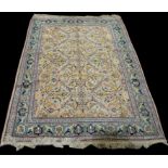 A Tabriz carpet, the light coloured ground with scrolling floral design, 285 x 196cms (112 x 77in.).