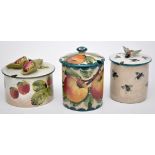 Wemyss ware, comprising: honey jar and cover, height 11cm; two conserve jars and covers,