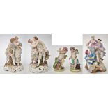 Five porcelain figure groups, comprising: pair of putti figures,