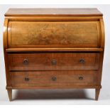 An early 19th Century Biedermeier burr walnut roll-top bureau, fitted sliding and raising action,