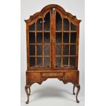 A Queen Anne style walnut display cabinet,
