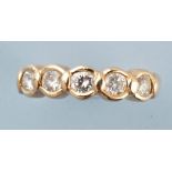 A five stone diamond ring, the brilliant cut graduated diamonds within collet mount,