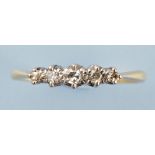 A five stone diamond ring, the graduated diamonds in white metal mount,