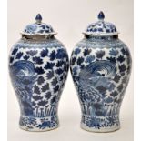 Pair of Chinese blue and white 'Phoenix' vases and covers,