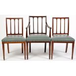 A set of eight Georgian style oak dining chairs,