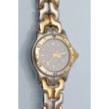 Tag Heuer: a lady's stainless steel centre seconds wristwatch,