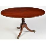 A Regency mahogany breakfast table, the oval top with reeded edge,