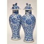 Pair of Chinese blue and white inverted baluster vases and covers,