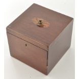 A George III mahogany tea caddy, with paterae to cover, fitted brass handles,
