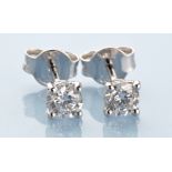 A pair of diamond stud earrings, each brilliant cut diamond weighing approximately 0.