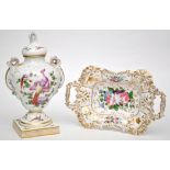 Rococo style urn and cover, the ogee body with exotic birds amongst foliage,