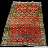 A Quashqai rug decorated with diamond-shaped medallions, 236 x 120cms 93 x 47in.).