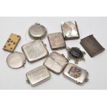 A horn and ivorine domino pattern vesta case, 5cms high; together with a silver vesta case,